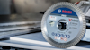Bosch X-Lock kapskiva, PRO 125 mm diameter, visas på en stapel av skivor.